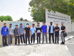 GR-12-Boys giving donation at Sharjah City for HumanitarianServices